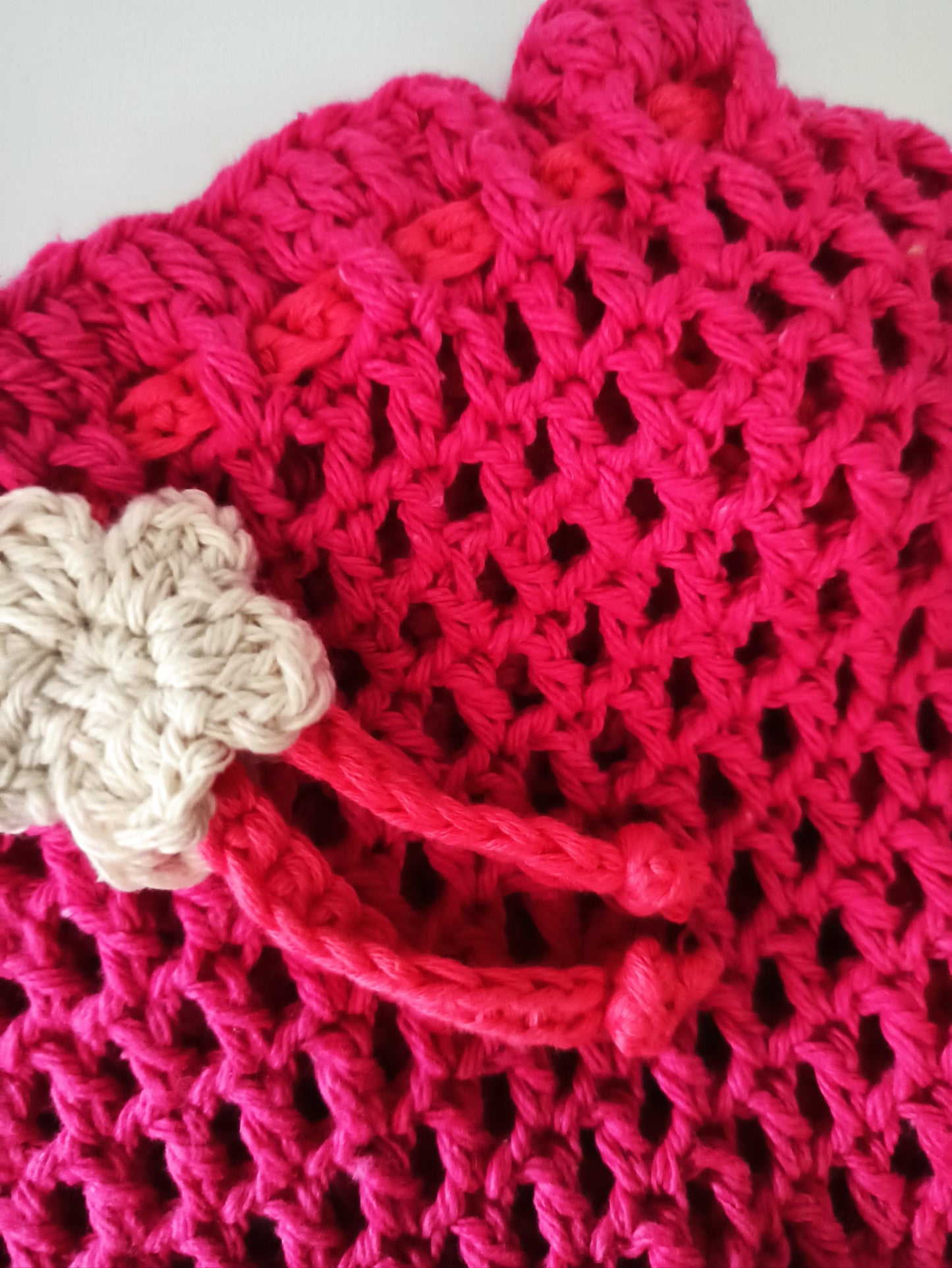 Blush handmade crochet crossover pouch bag close up